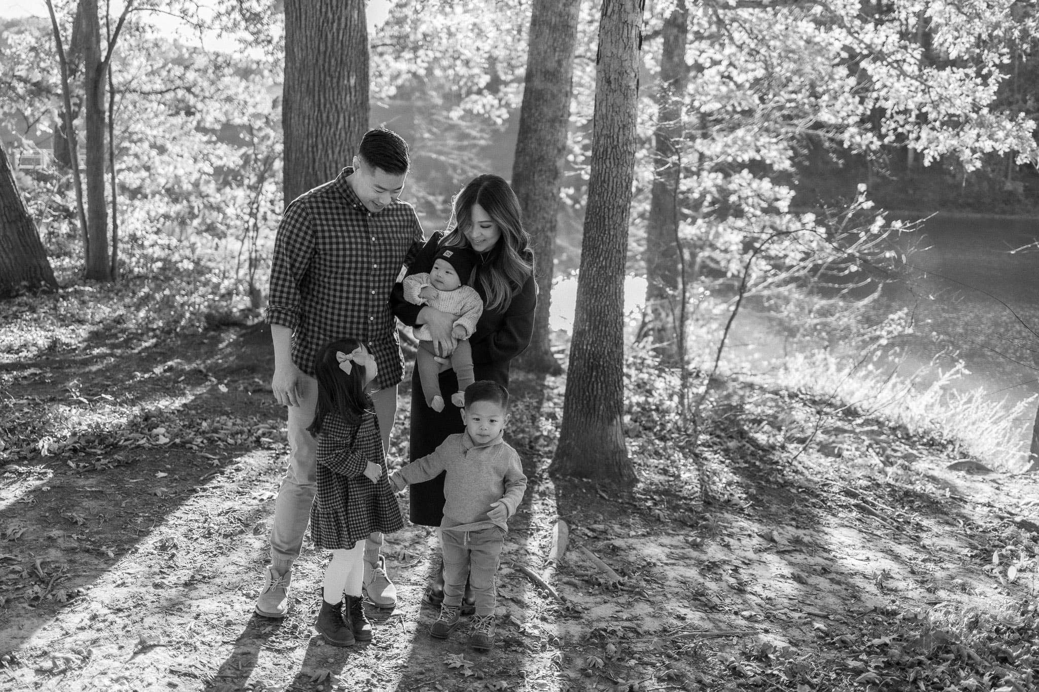 Black and white family portrait among the trees