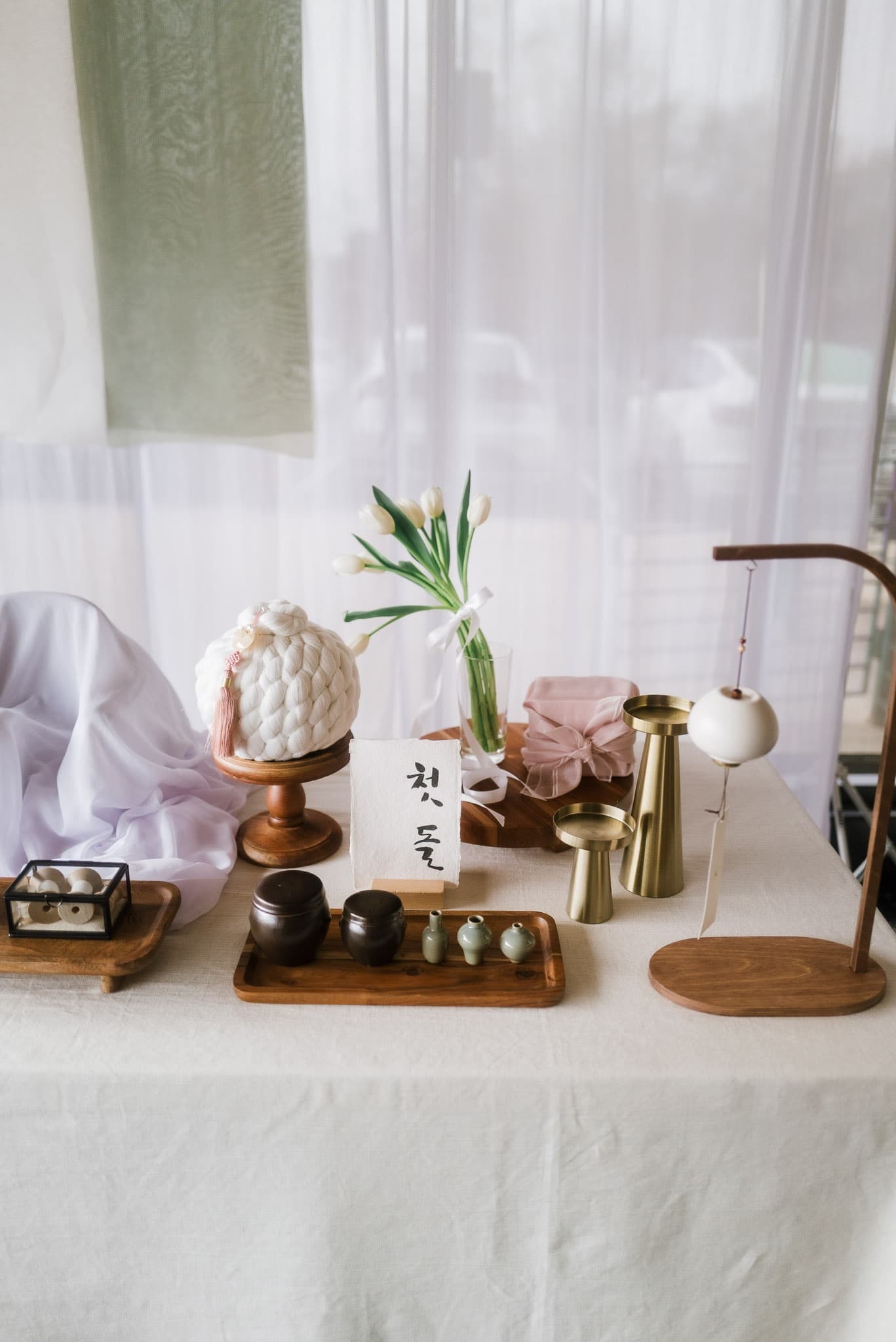 Brass vessels and a tea set on the first-birthday table