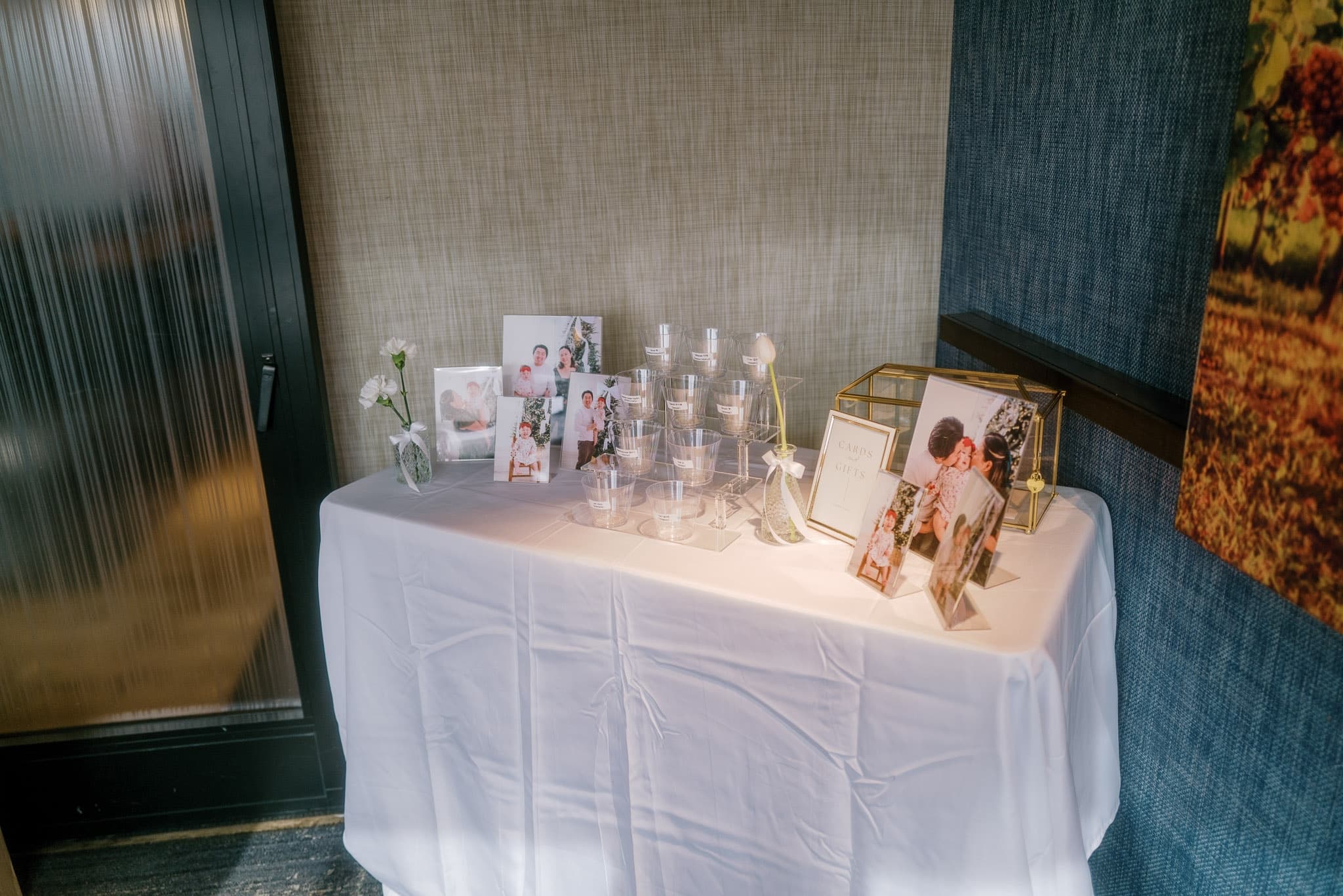 Framed photos and keepsakes on a side table