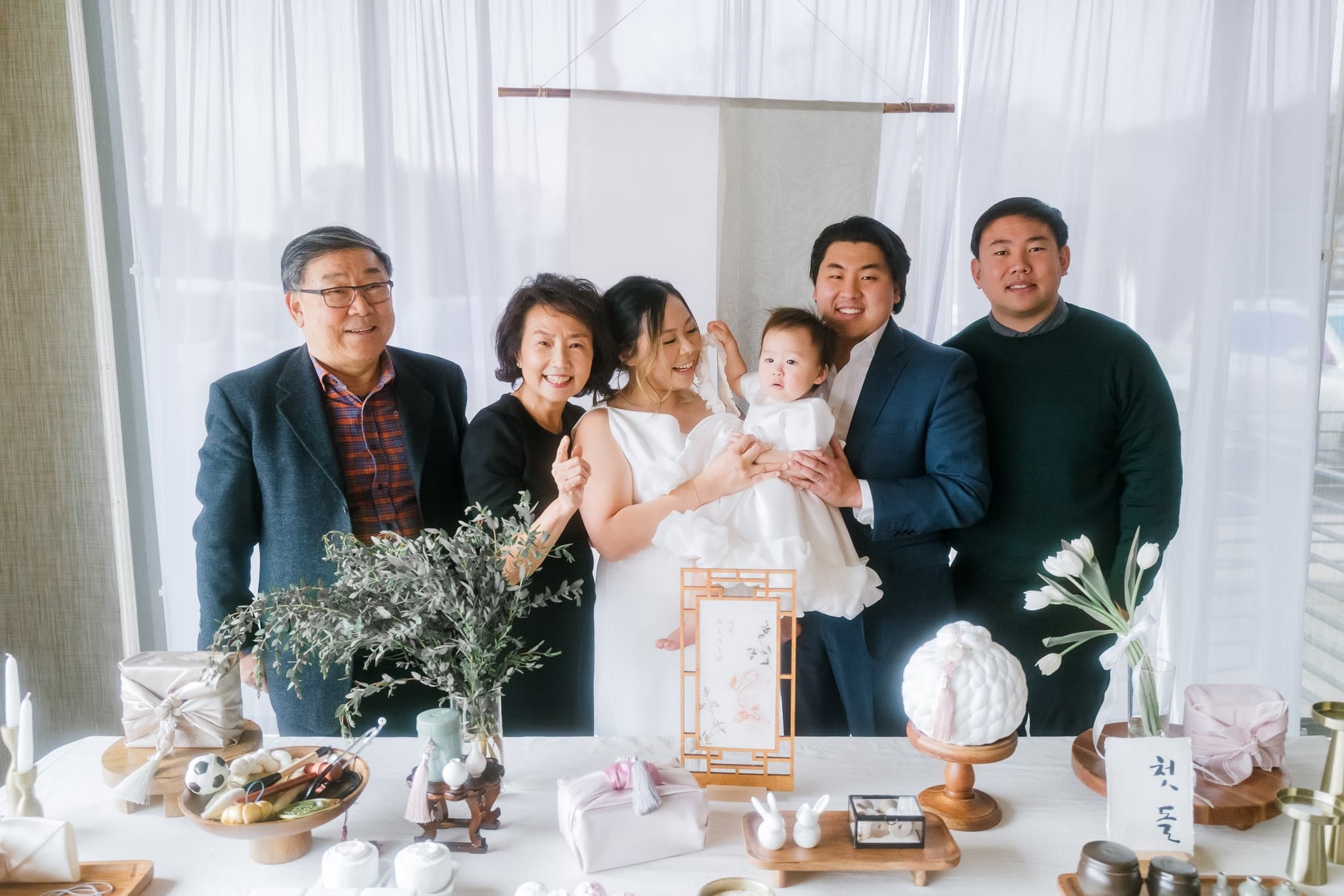 Grandparents and family with the baby at the table