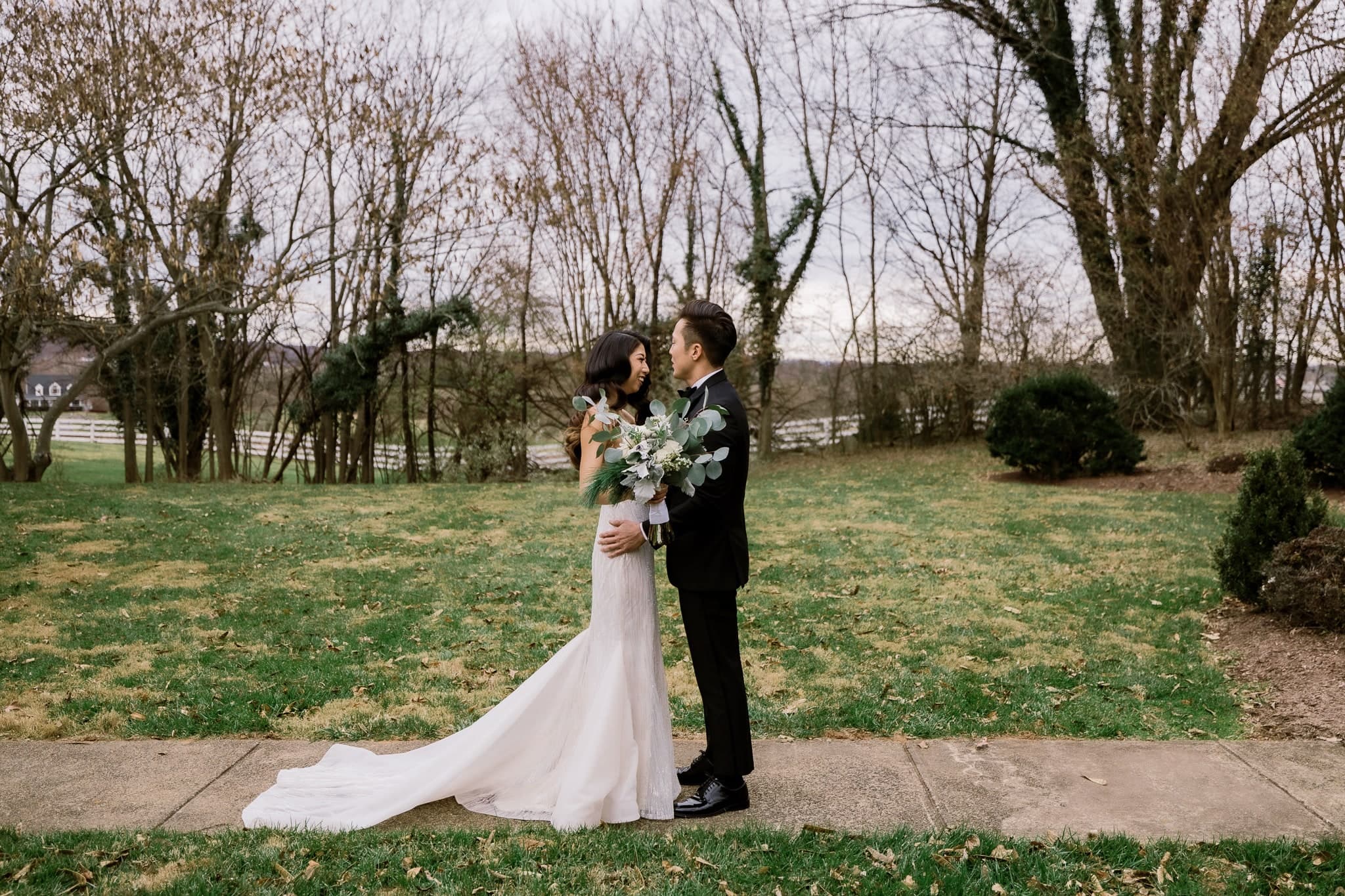Couple embracing after their first look in the garden