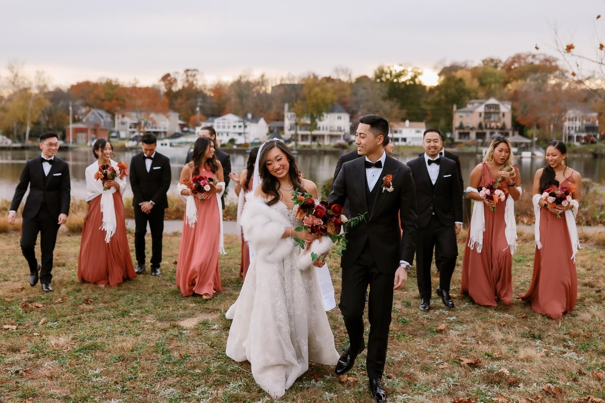 Wedding party walking together along the lakeshore