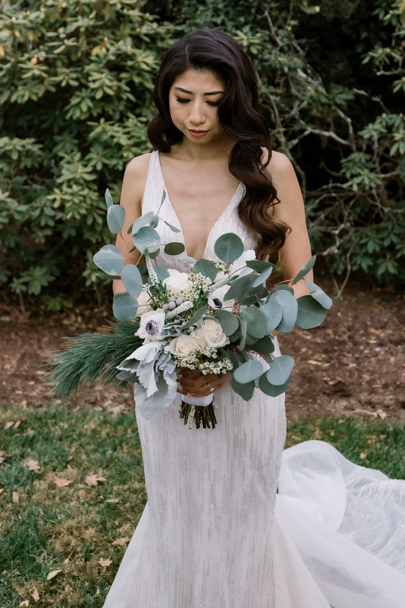 Bride holding a eucalyptus bouquet