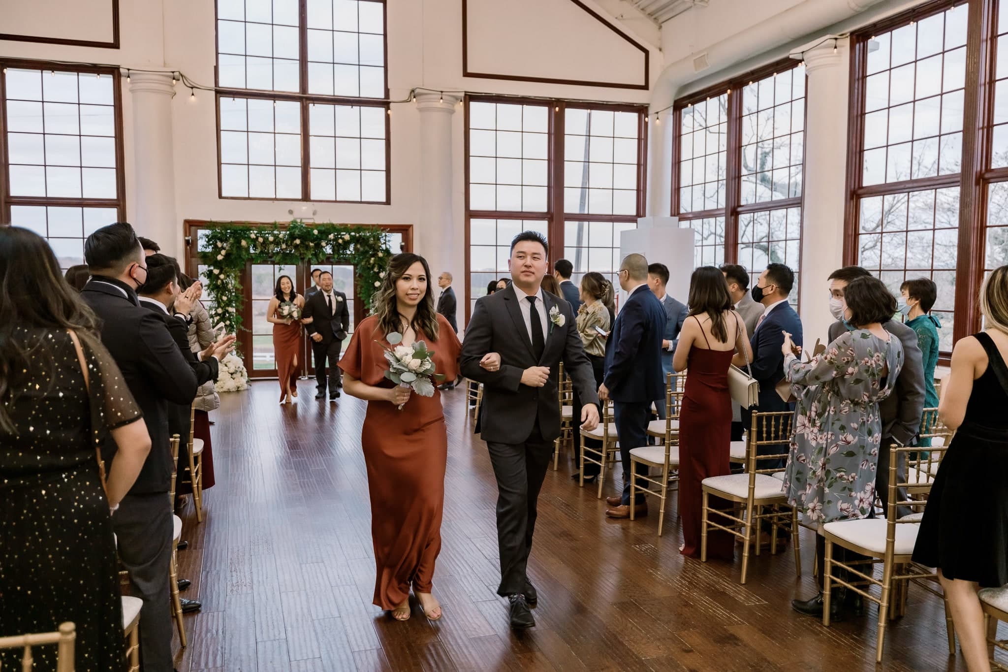 Guests celebrating as the wedding party leaves the ceremony