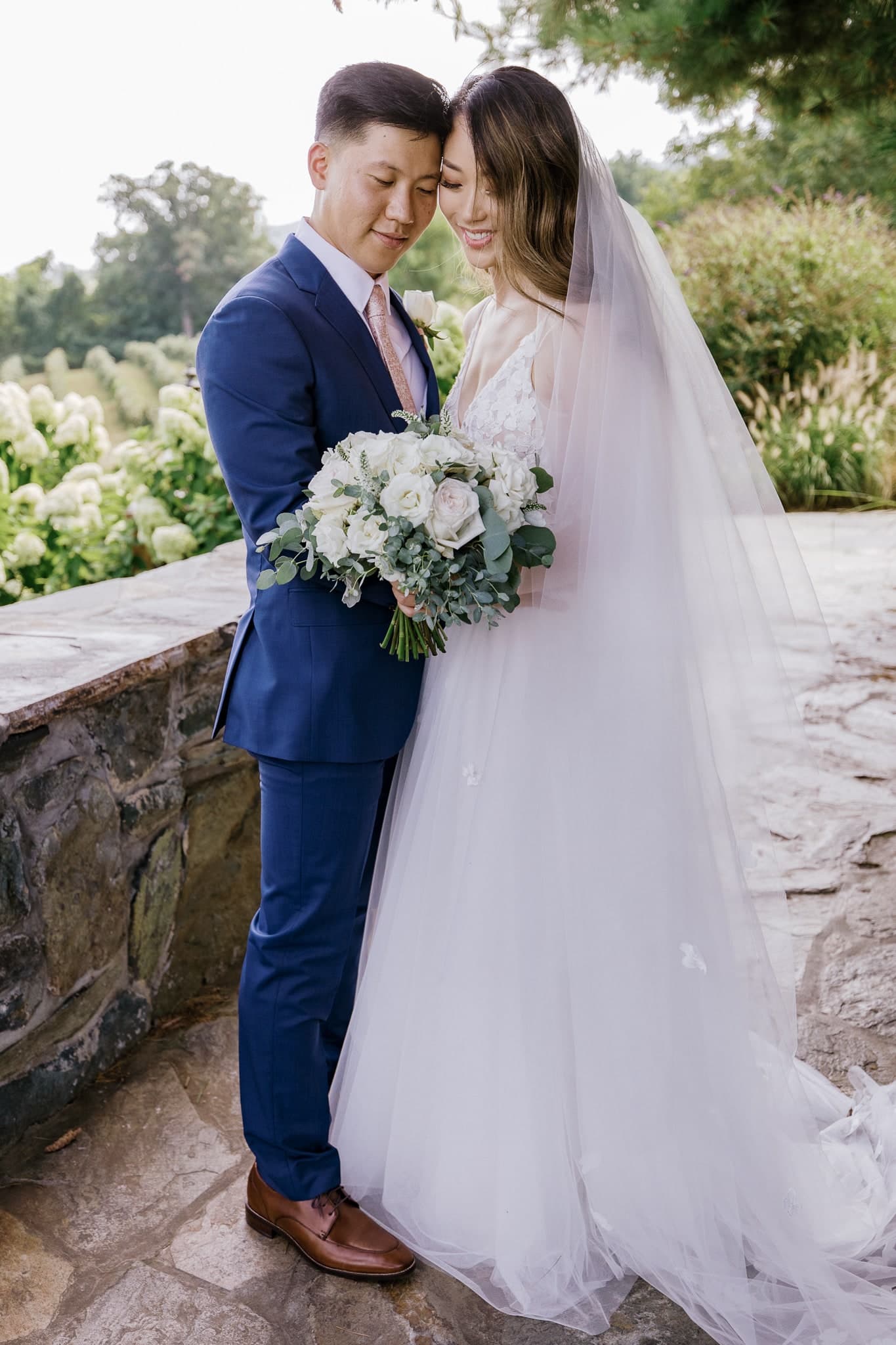 Couple on a stone terrace overlooking the valley