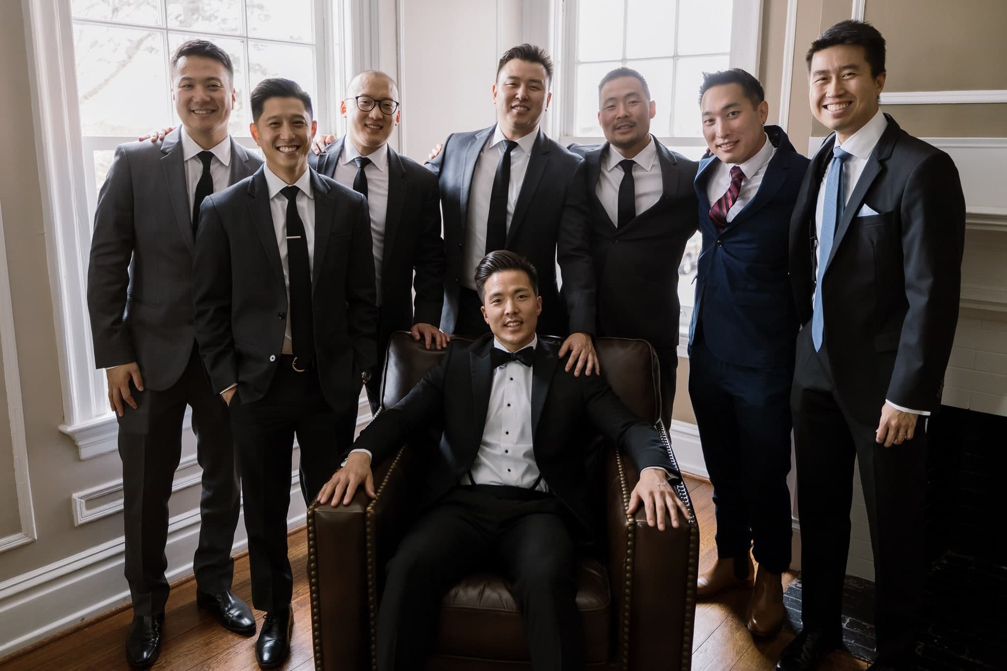 Groom with his groomsmen in the sunroom