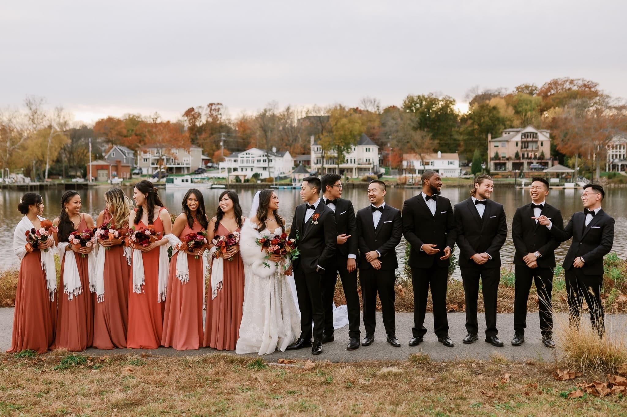 Bridesmaids and groomsmen by the lake