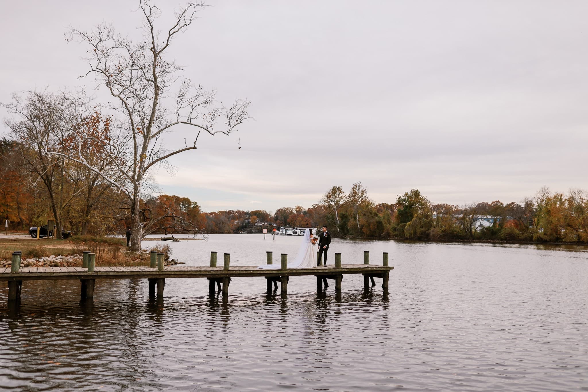 Couple embracing on the dock after their first look
