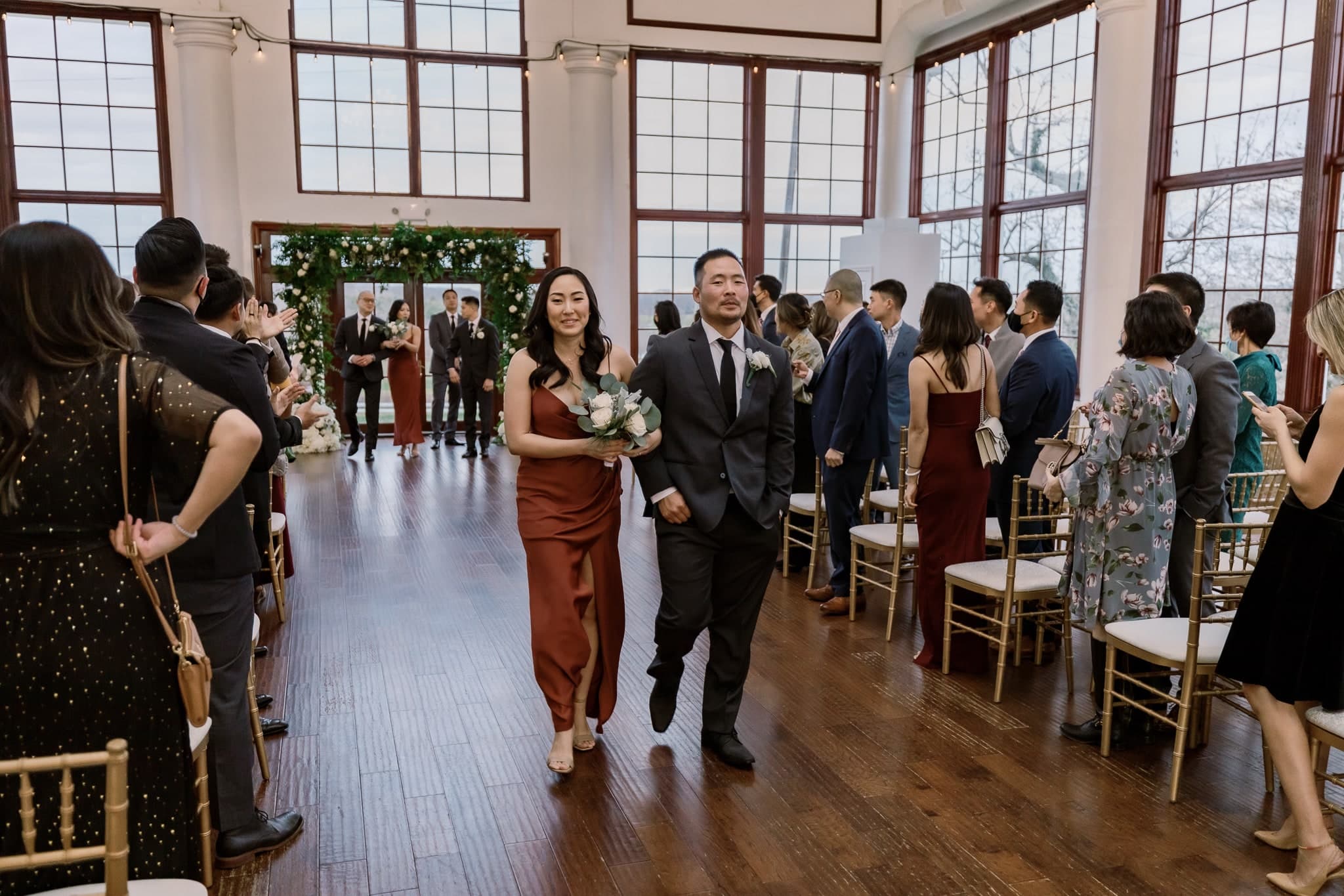 Wedding party walking back up the aisle